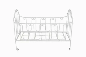 A vintage French folding wrought iron child's cot.